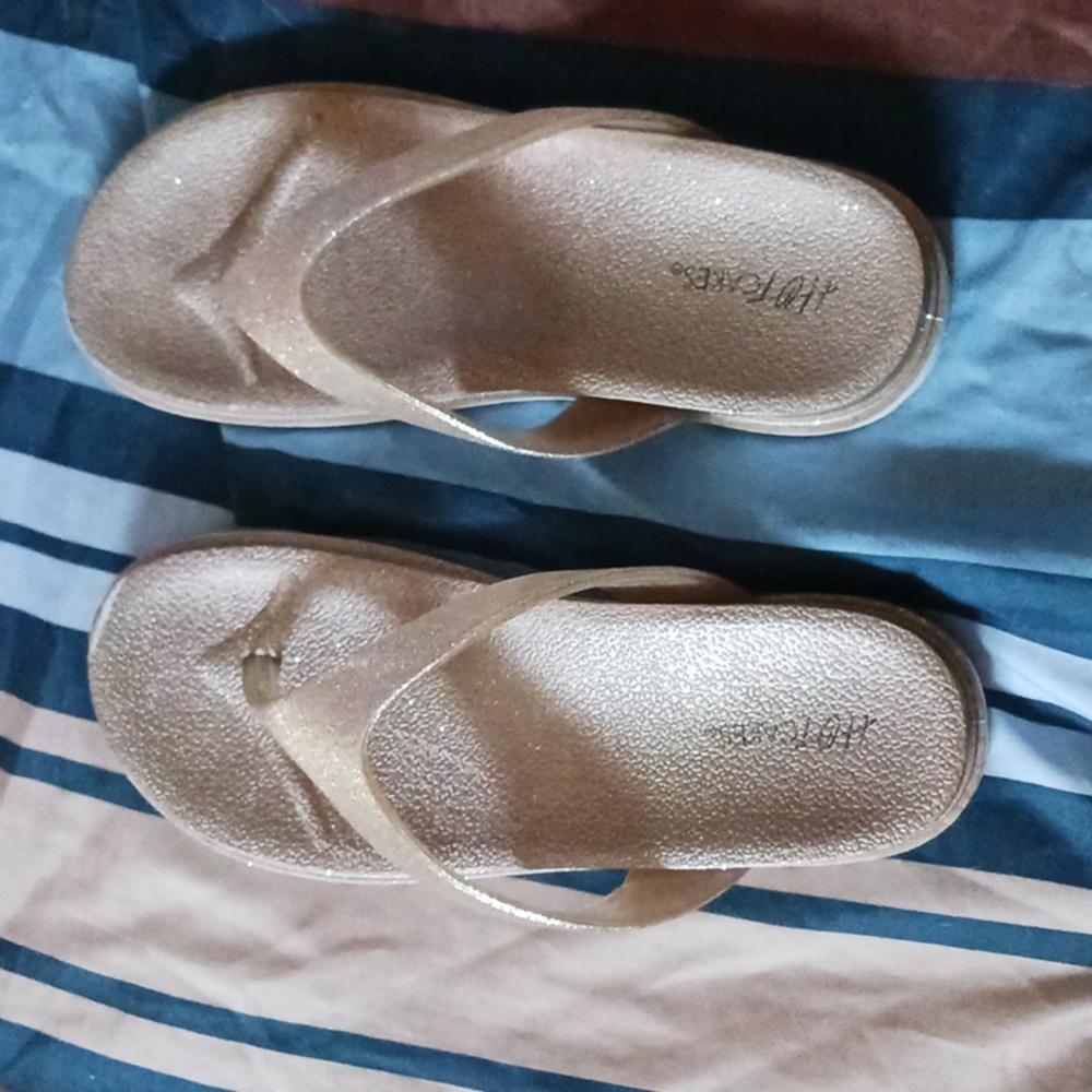 Rose gold flip flops